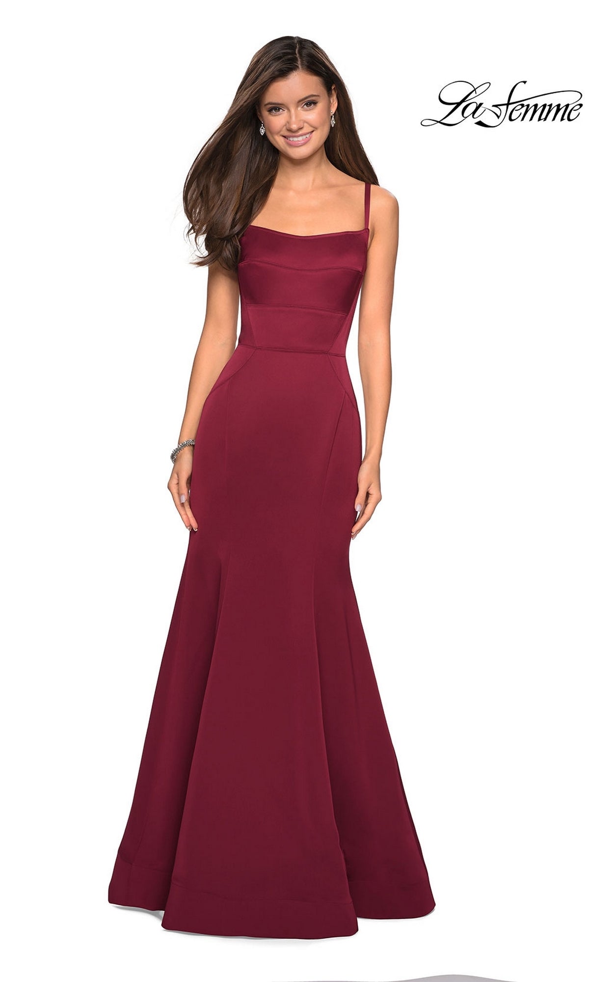 A woman models the La Femme Square-Neck Simple Long Prom Dress 27524 in burgundy, featuring a sleeveless, floor-length design with a fitted bodice and flared mermaid skirt, posed against a white background with the La Femme logo in the top right corner.